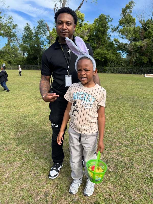 teacher and student with easter basket and bunny ears