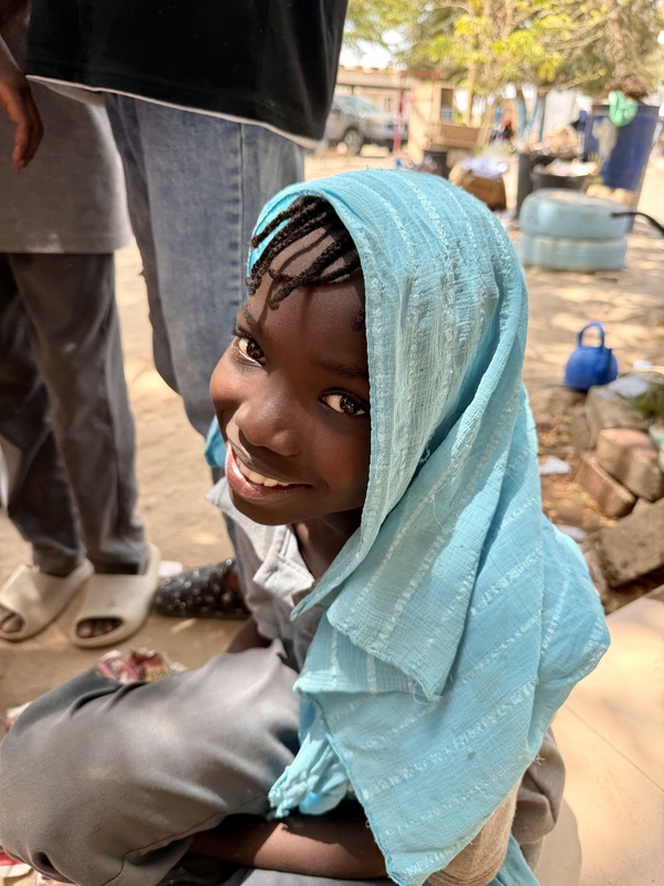 female student in Senegal, smiling