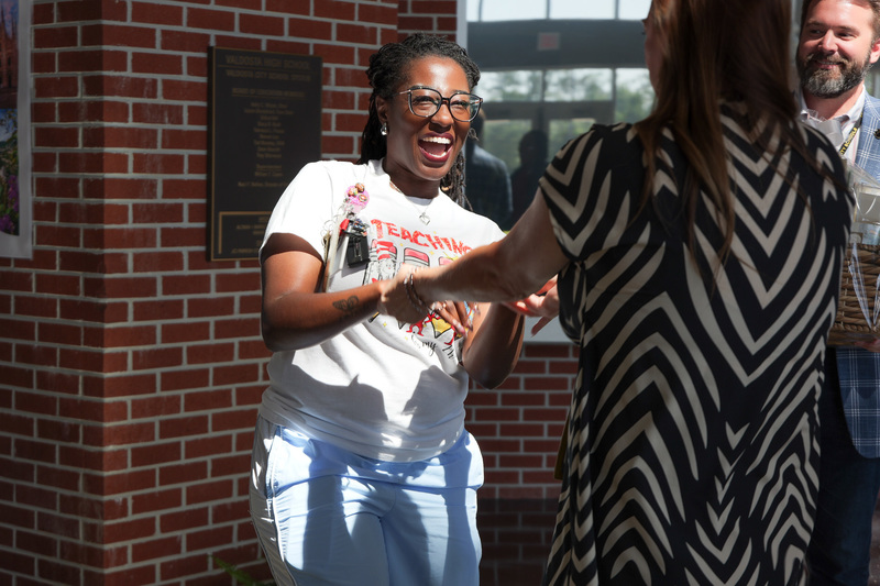 para of the year smiling in shock, holding hands with SPED director