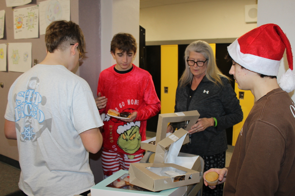 Margo handing out donuts