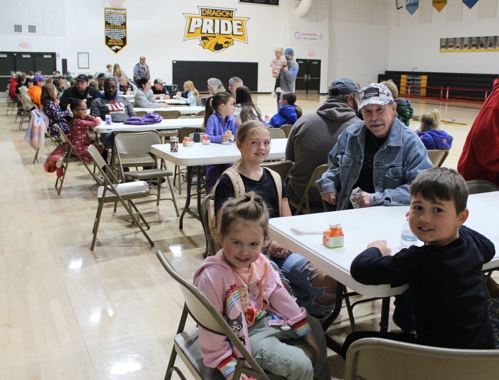 Families in the gym for Donuts with Dad