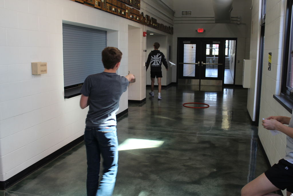 Tossing the plane to the hula hoop target