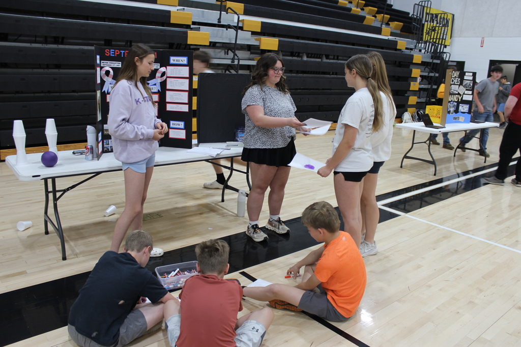 Girls handing out info.