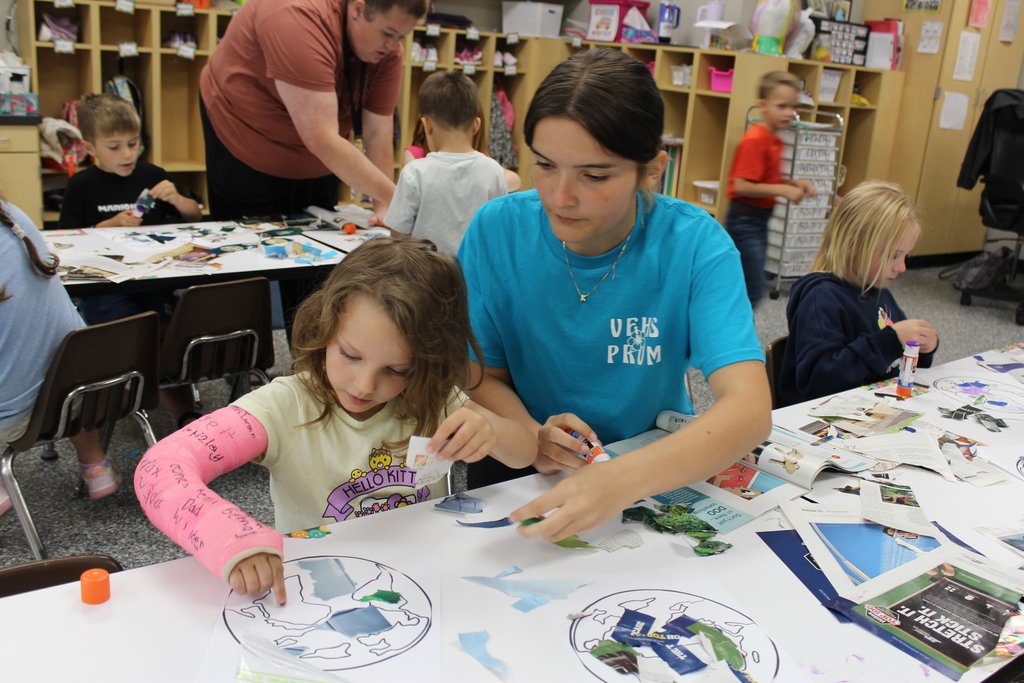 HS Student helping PK Student