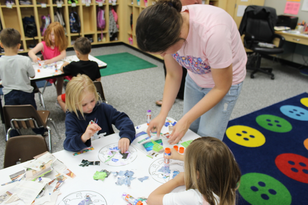 Miss Larson helping students