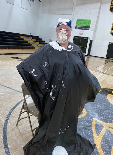 Teacher with pie in face