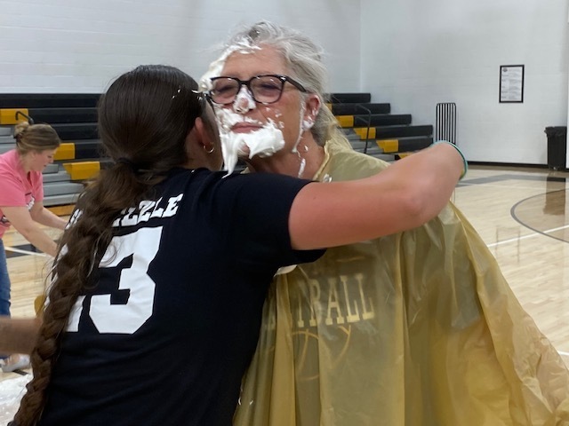Girl hugging Mrs. Ellerman