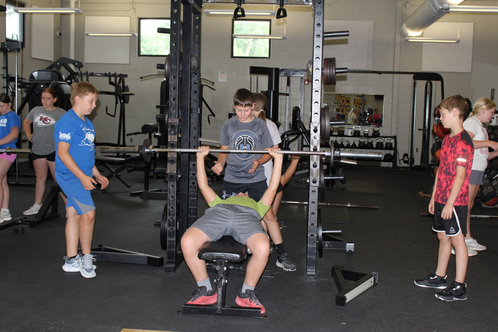 Boys lifting weights