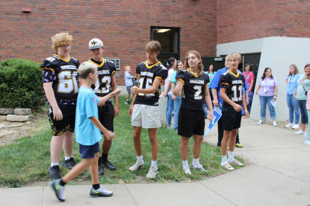 FB Team greeting kids