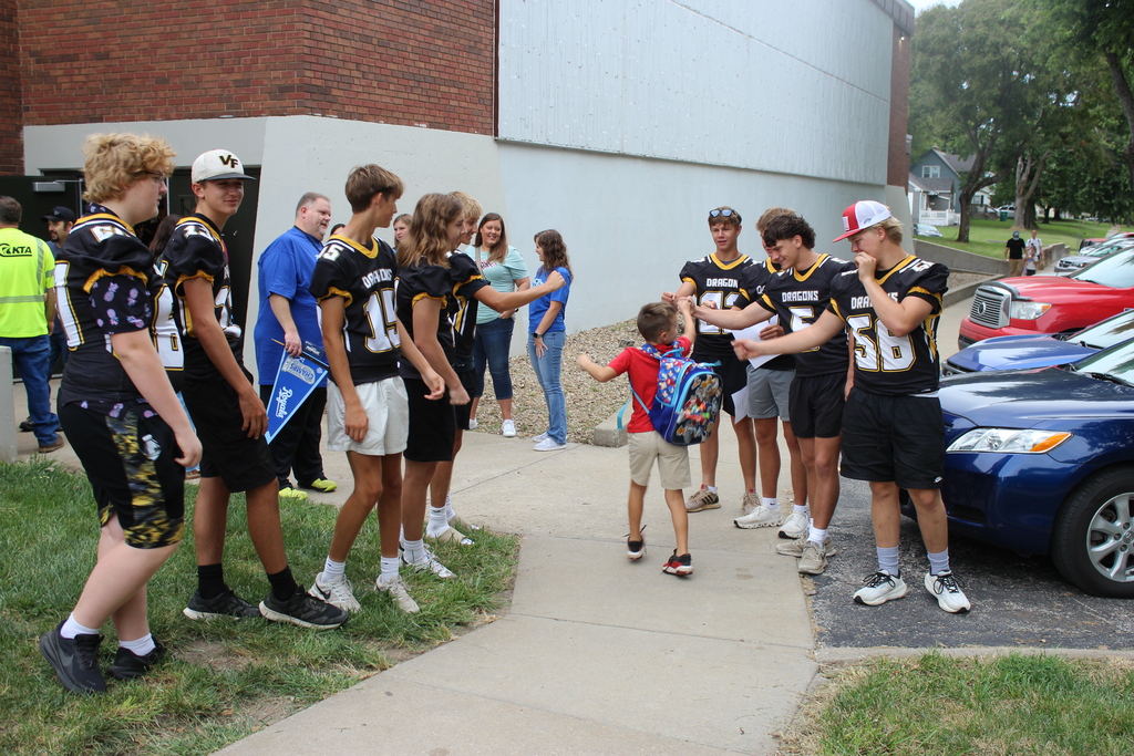 FB Team greeting kids