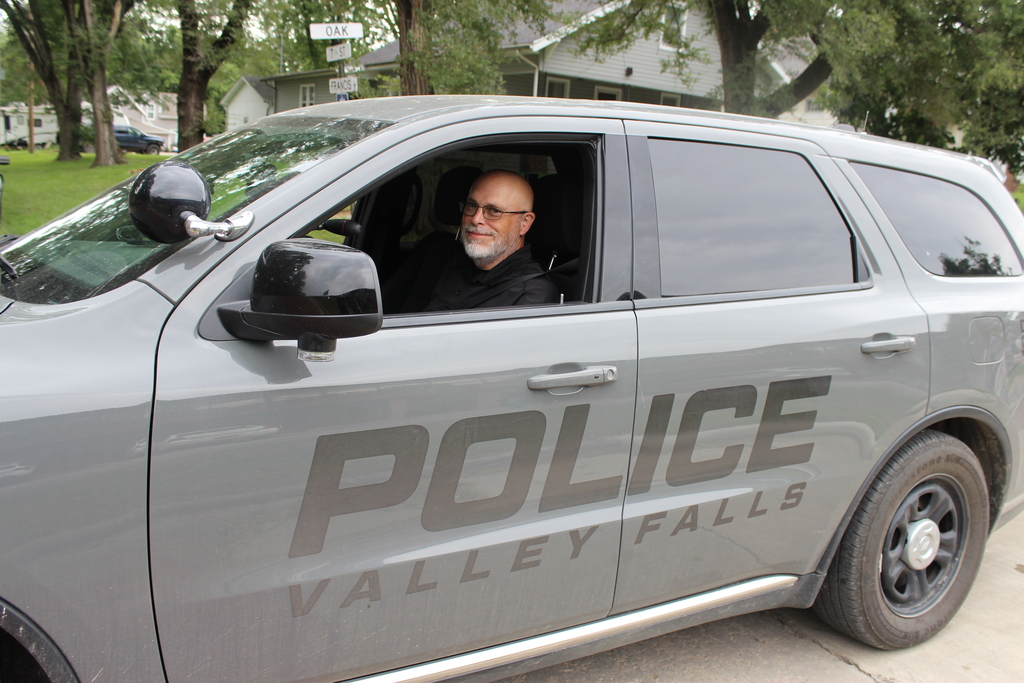 Cary in police car
