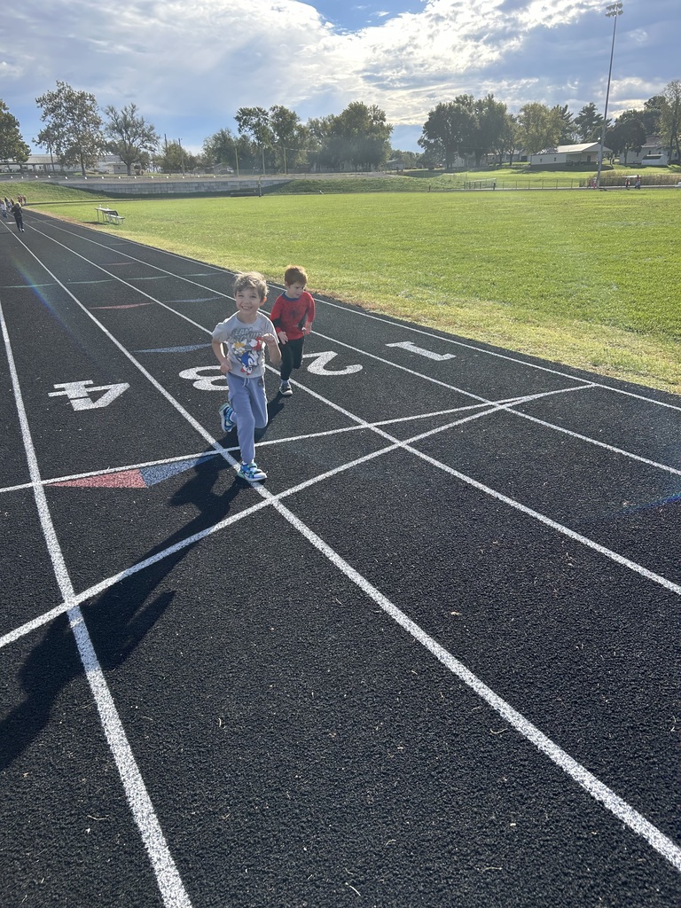 Two boys running on track