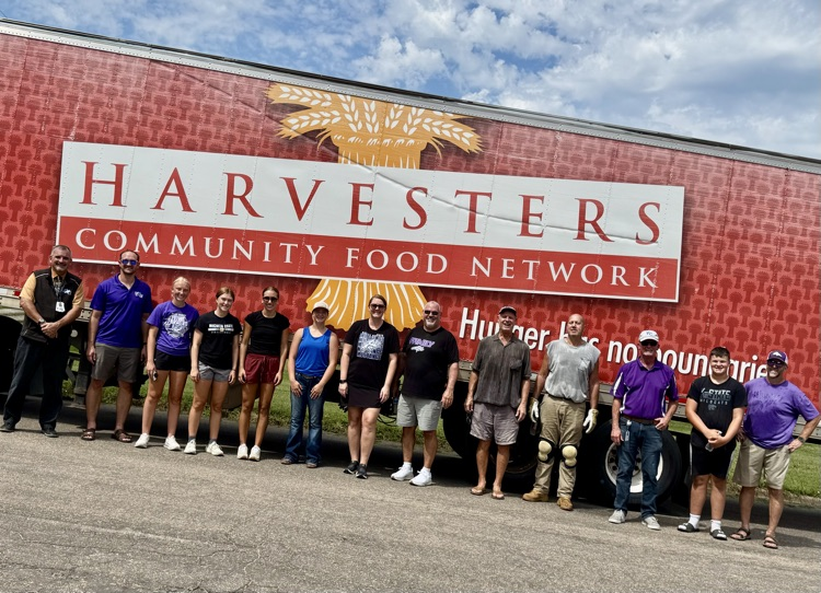 harvesters admin and students working together