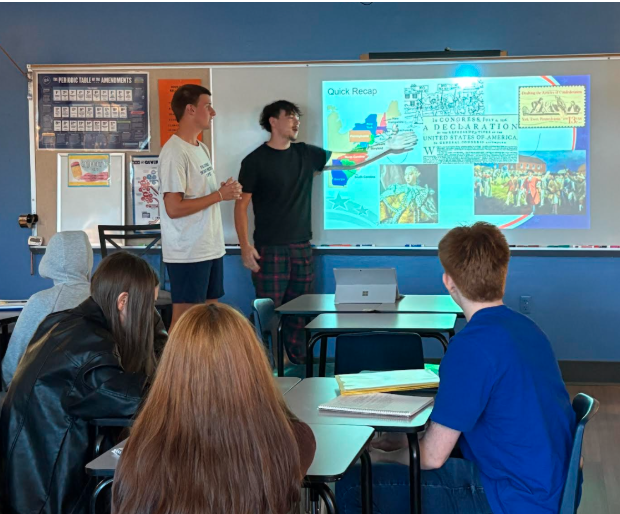 Students also get to take charge of class reviews, as seen here by two Government students leading their peers.