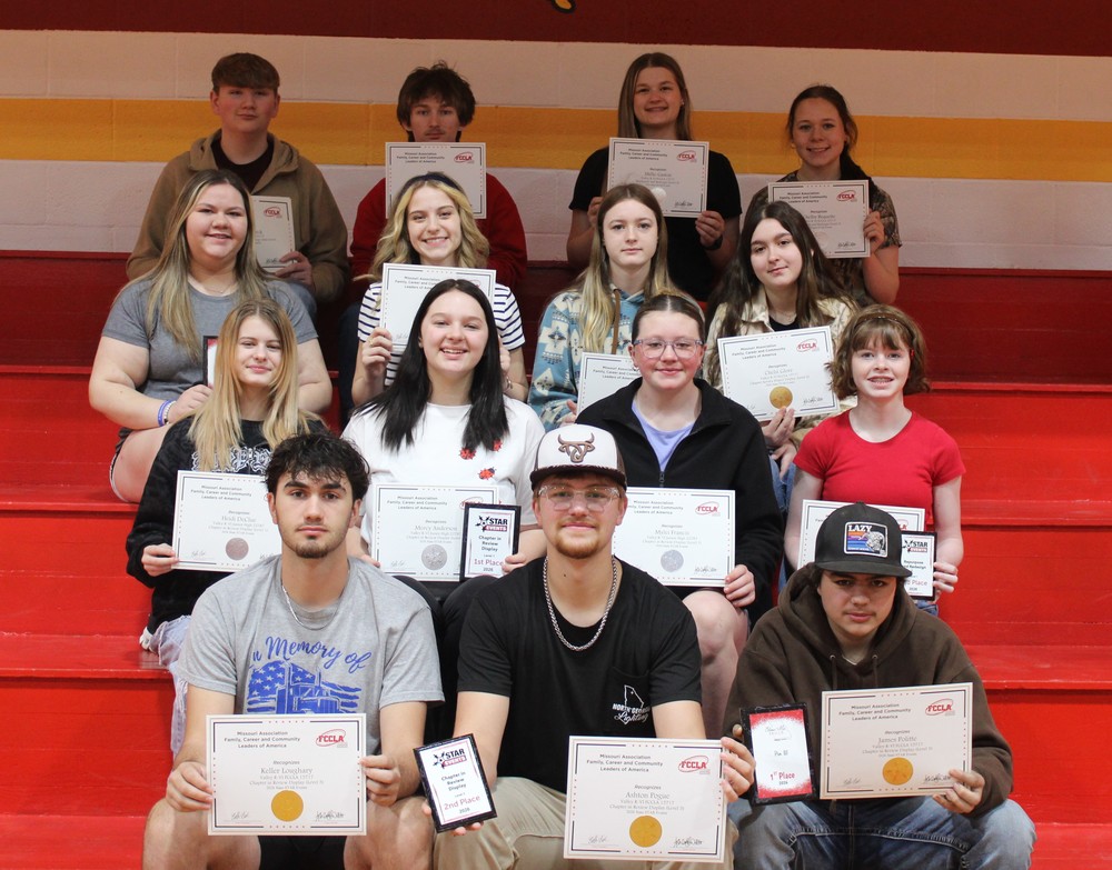 FCCLA State Qualifiers sitting on bleachers with their certificates