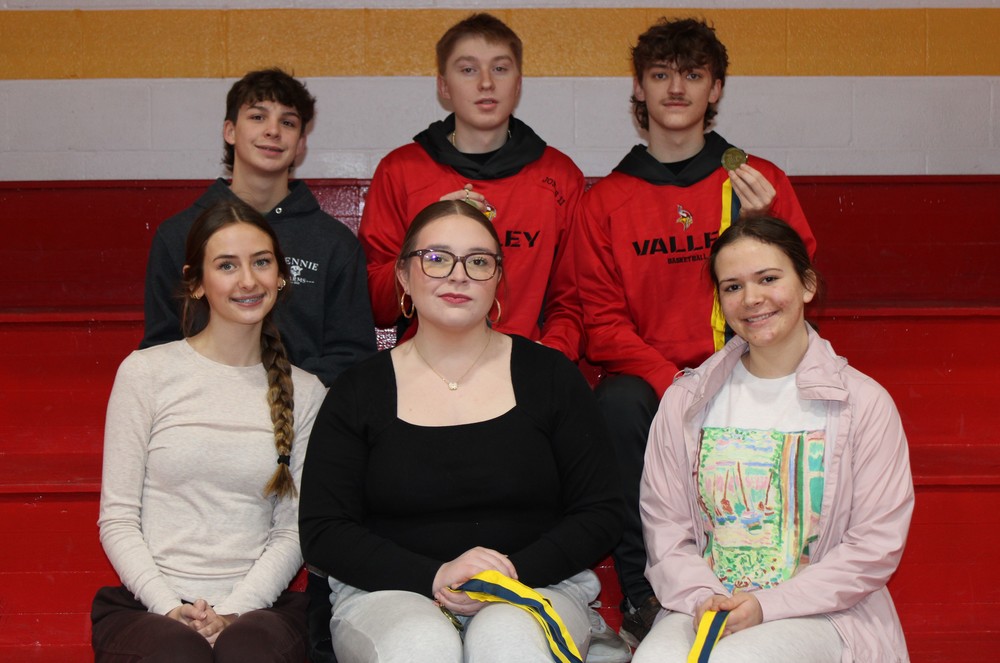 Students posing with medals