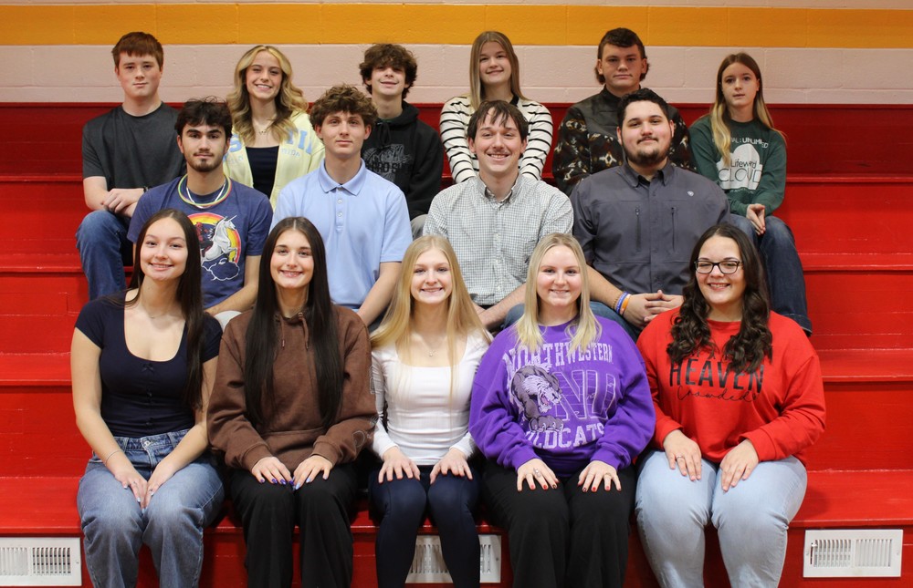 Homecoming court seated on bleachers