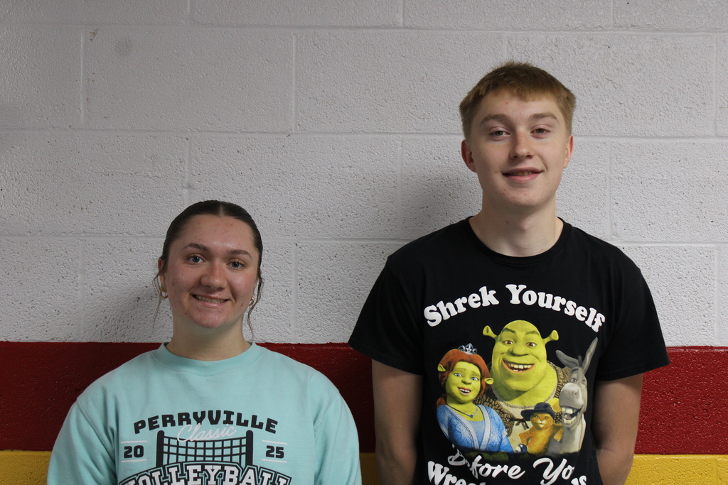 Two students smiling and posing