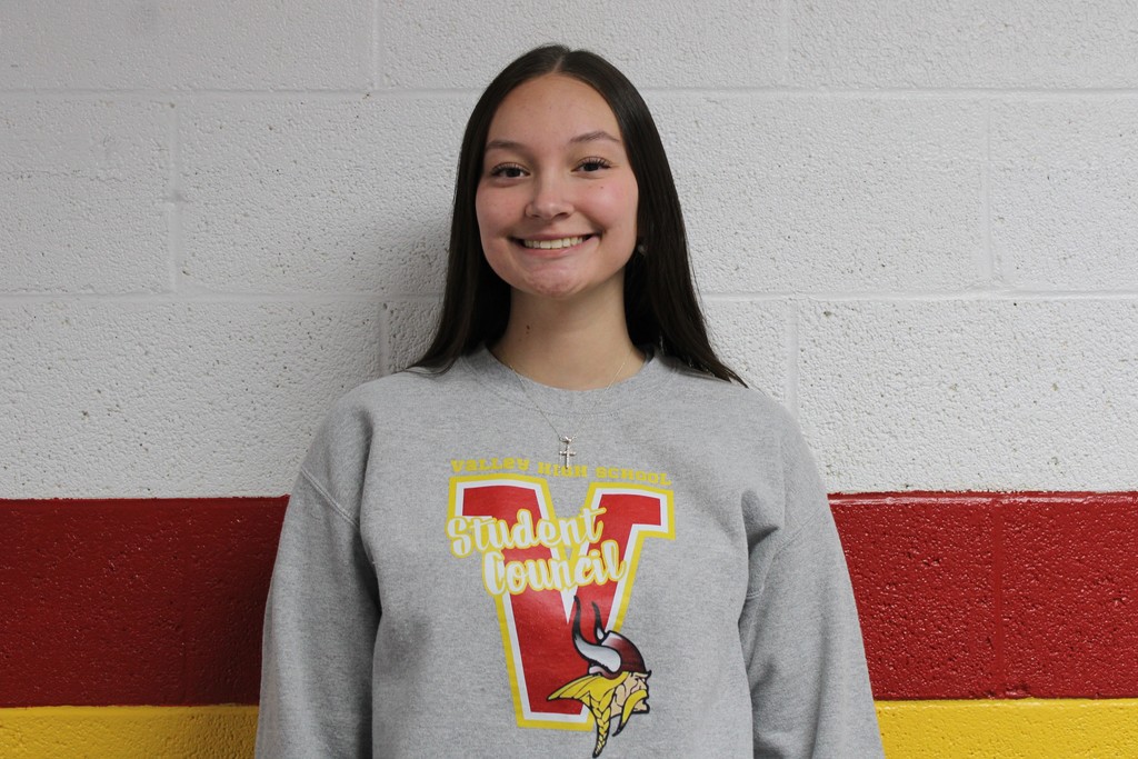 Student Posing for an award