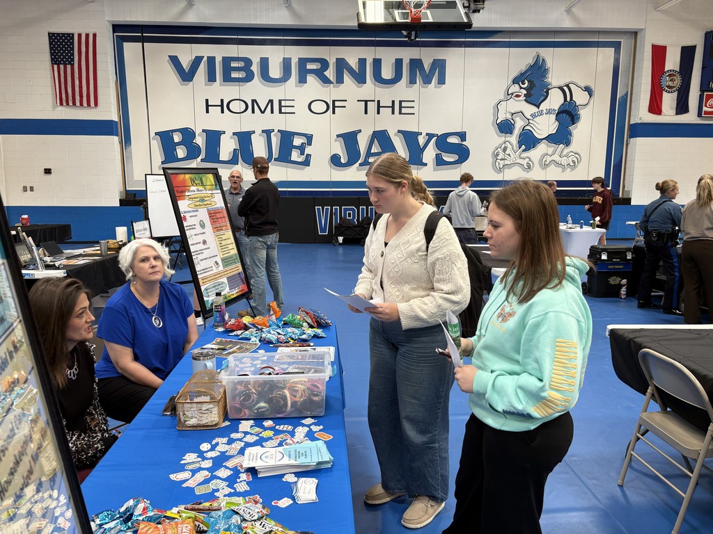 Students talking to an adult