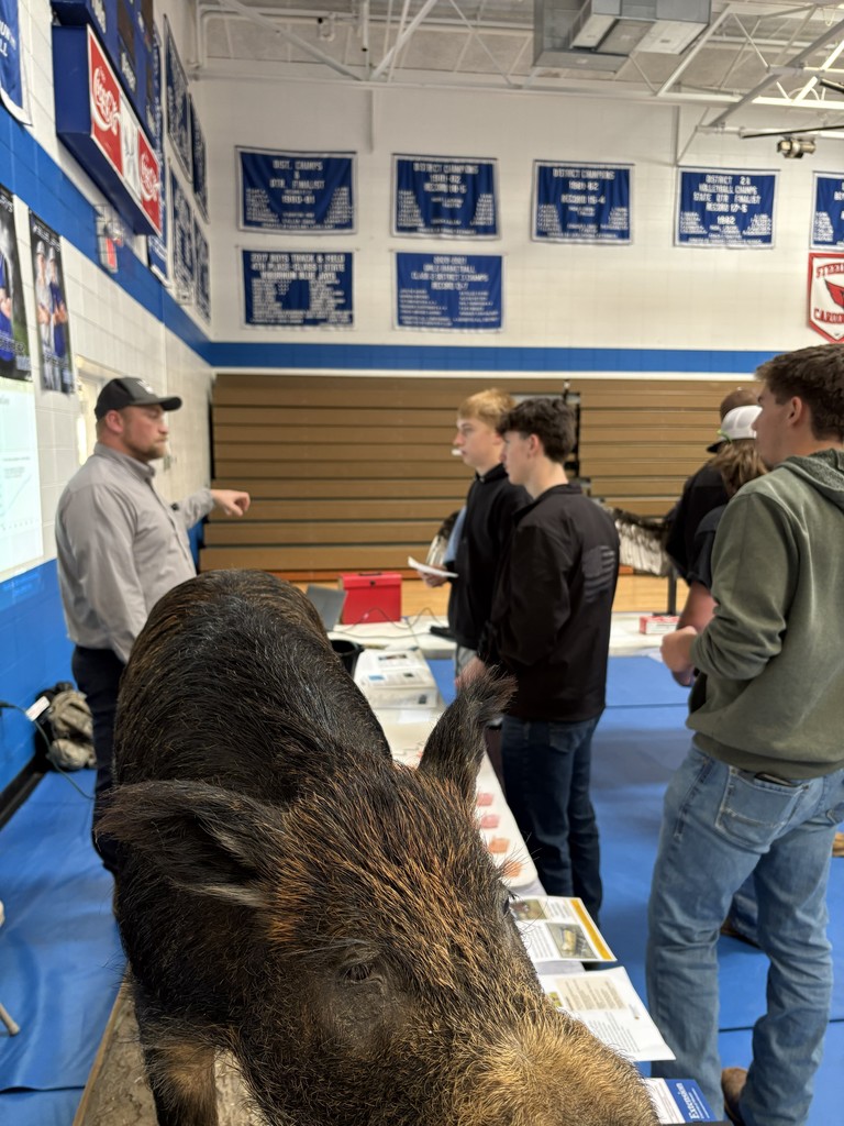 Students talking to adult