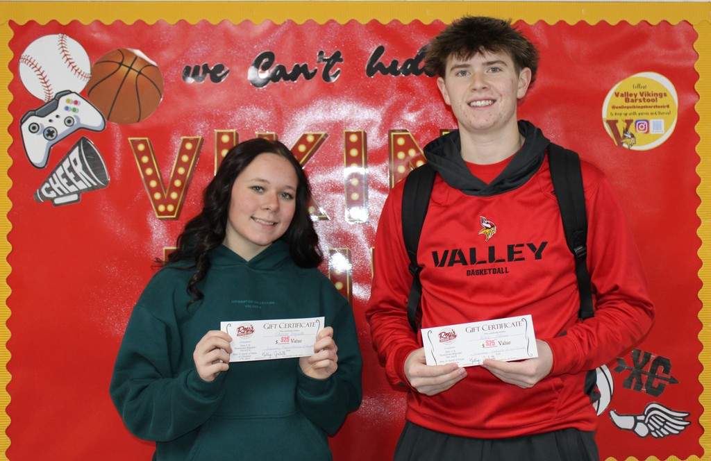 Students posing with certificates