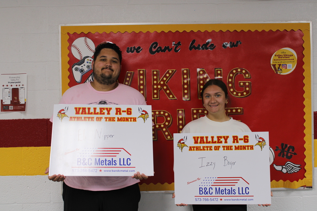 Two students posing for athlete of the month