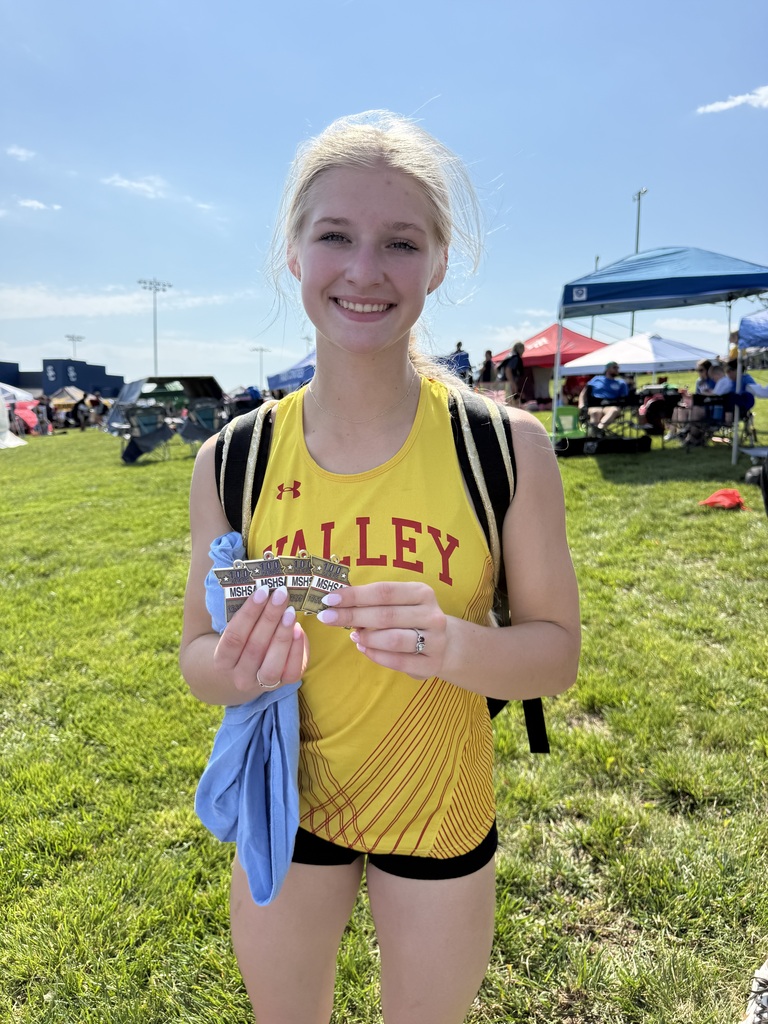 Student Holding Medals