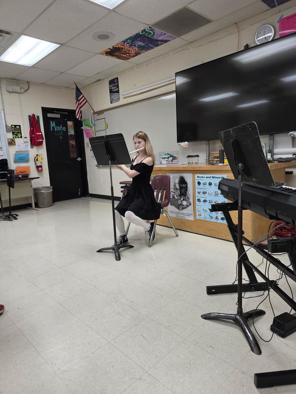 Student Playing Instrument