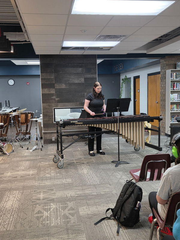 Student Playing Instrument