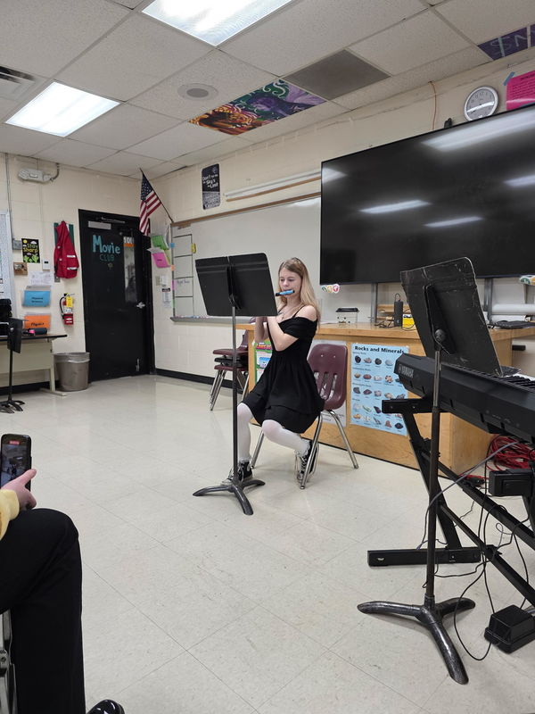 Student Playing Instrument