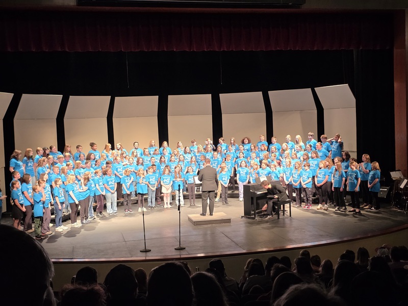 students performing on stage
