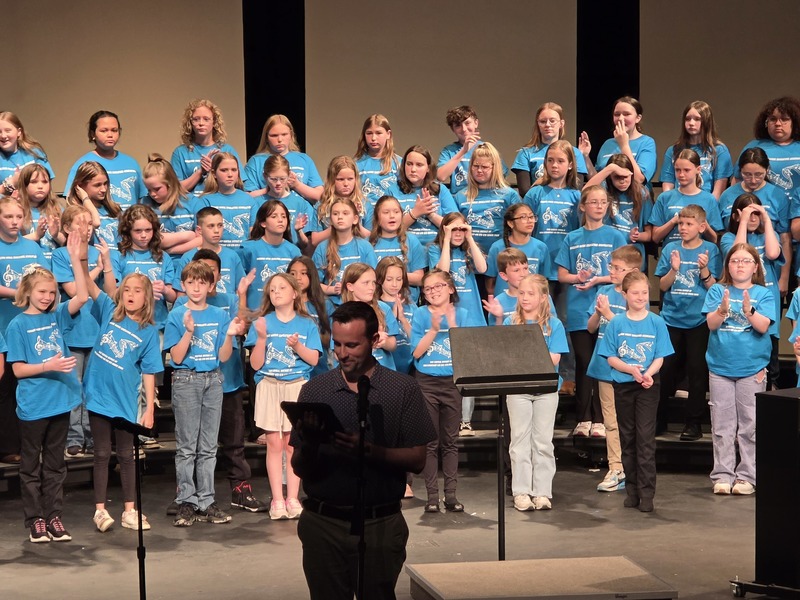 students performing on stage