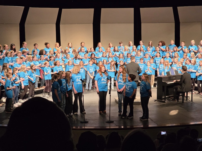 students performing on stage