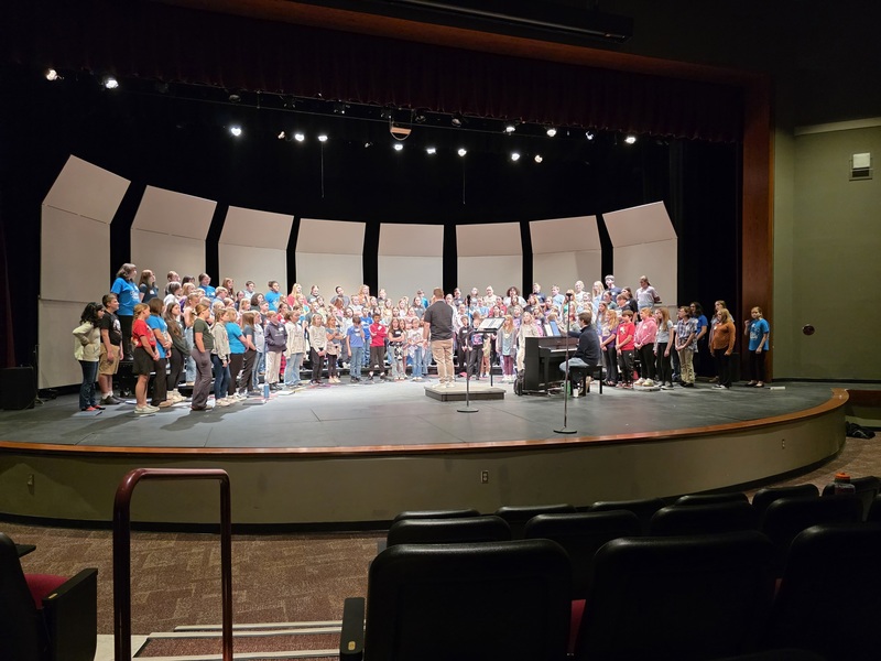 Students performing on stage