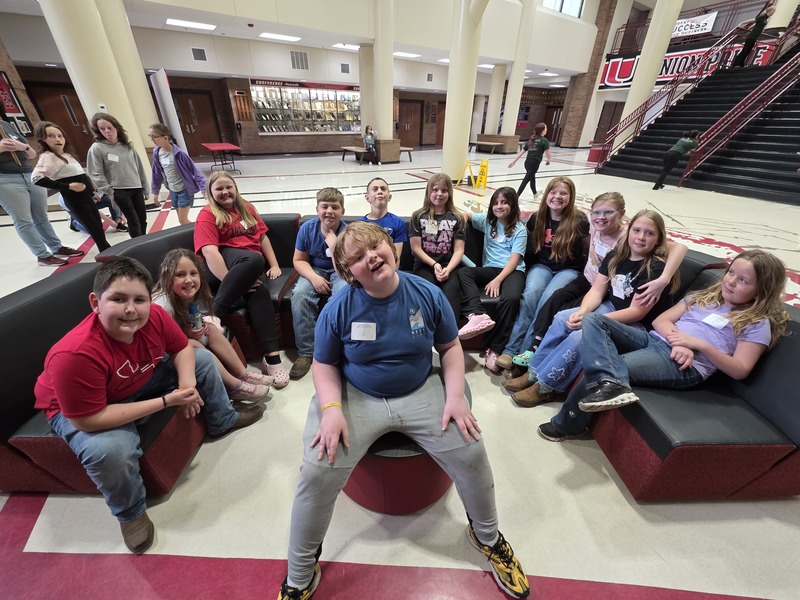 Students posing on couches