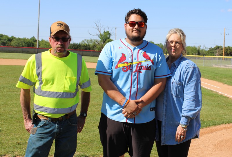 Student and Parents on Baseball Field