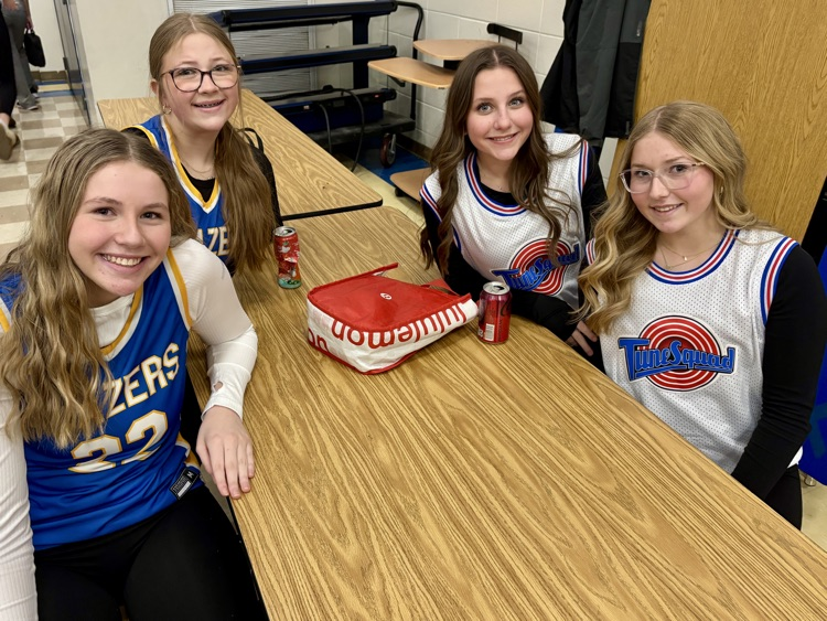 students at lunch table in jerseys