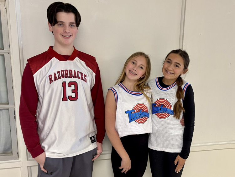 students in the hallway in jerseys