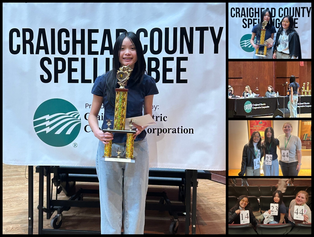 Spelling Bee winners with trophey