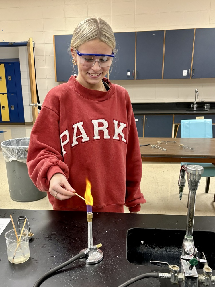 girl doing flame test lab