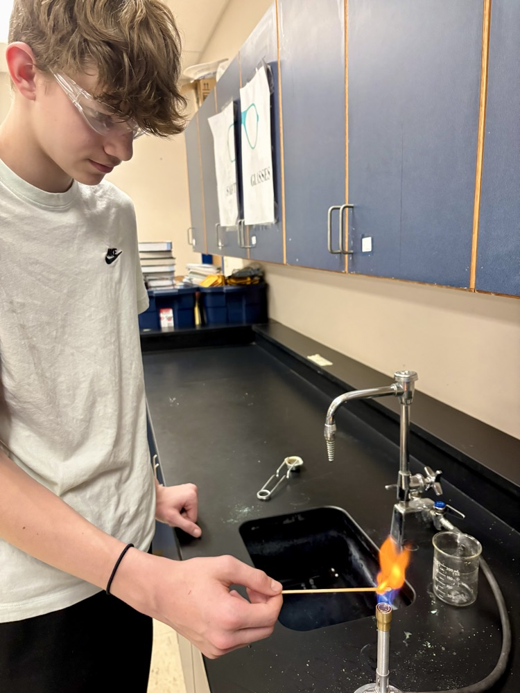 boy doing flame test lab