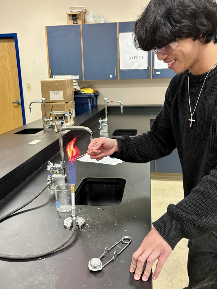 boy doing flame test lab