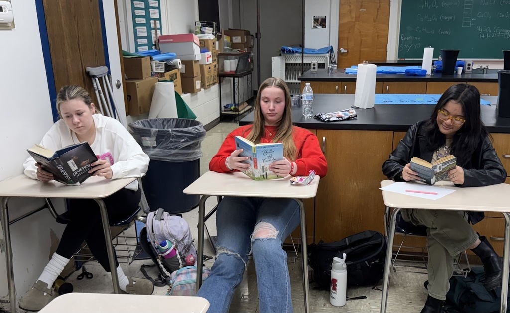 students in classroom reading