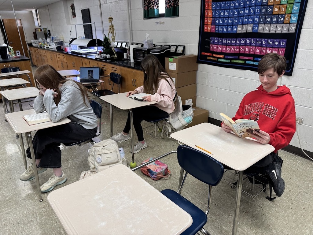 students in classroom reading