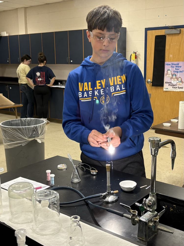 student burning magnesium
