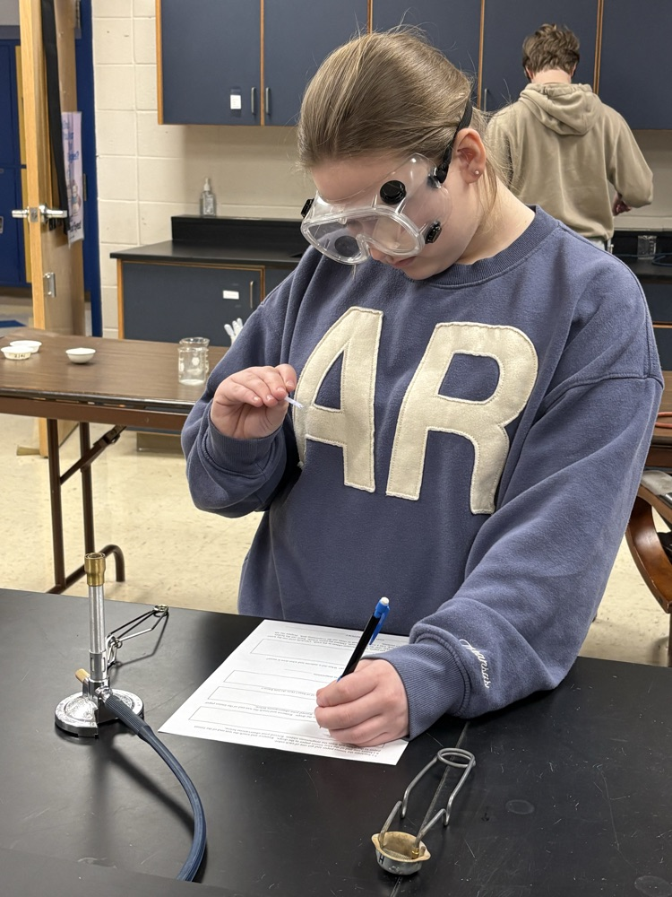 student making lab notes