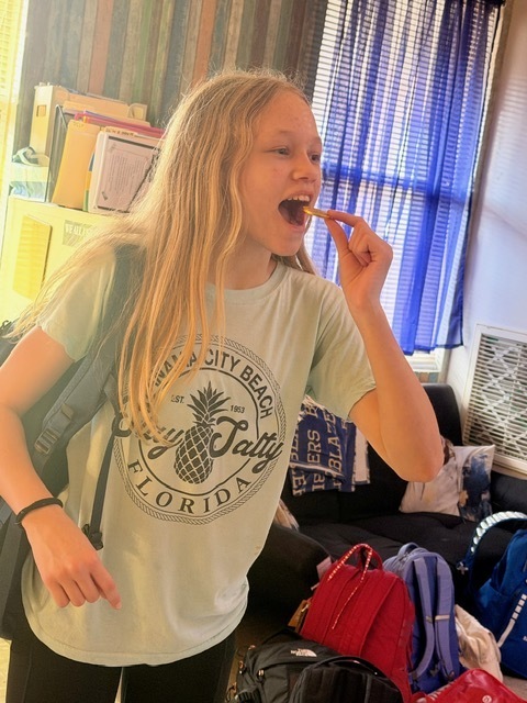 math student eating a chocolate coin