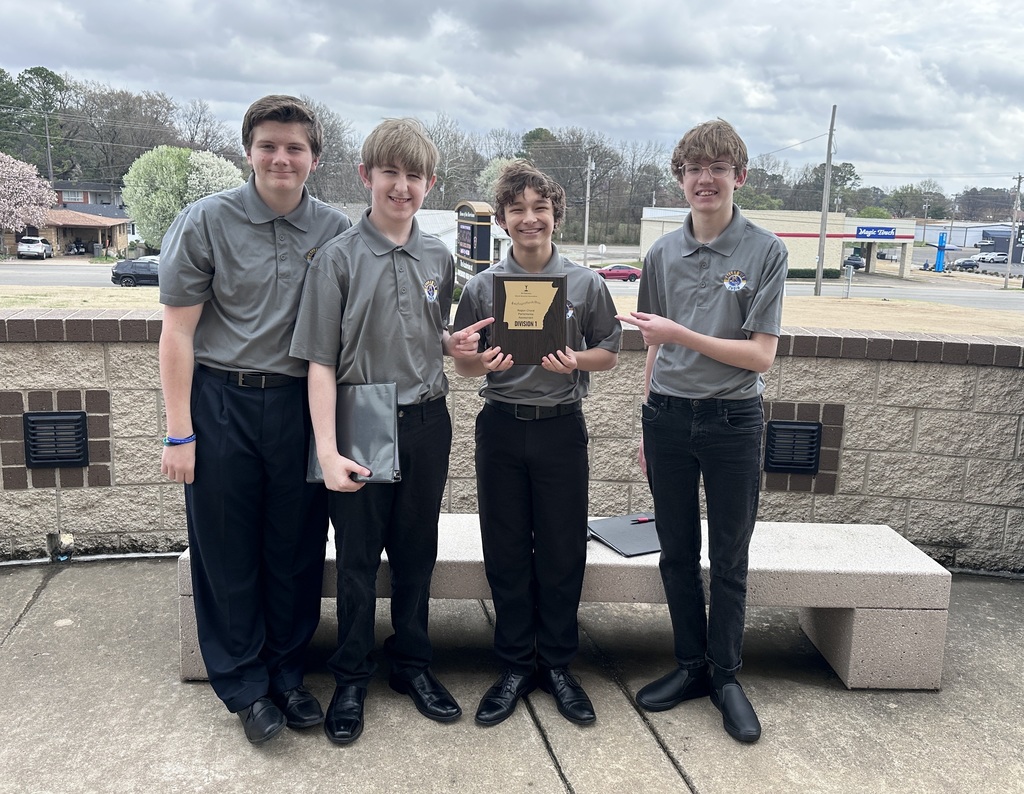 four boys with trophey