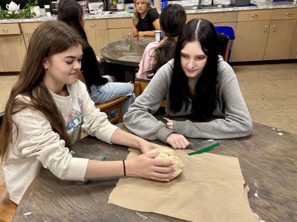 students at table working on food project